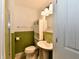 Cozy half-bathroom with traditional fixtures and charming accents at 812 Madison St, Frankton, IN 46044