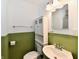 Traditional bathroom with sink, toilet, and mirror at 812 Madison St, Frankton, IN 46044