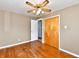 Bedroom features hardwood floors, a ceiling fan, a closet, and a doorway at 812 Madison St, Frankton, IN 46044