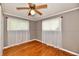 Bedroom with natural lighting from the windows and hardwood floors with ceiling fan at 812 Madison St, Frankton, IN 46044