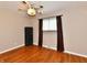 Bedroom with hardwood flooring, window, and ample space at 812 Madison St, Frankton, IN 46044