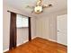 Bedroom with hardwood floors, closet, and window at 812 Madison St, Frankton, IN 46044