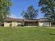 Charming single-story home with a well-maintained lawn, porch, and attached two car garage at 812 Madison St, Frankton, IN 46044