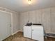 Bright laundry room with washer, dryer, and storage area at 812 Madison St, Frankton, IN 46044