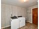 Well-lit laundry room with washer, dryer, and ample space at 812 Madison St, Frankton, IN 46044