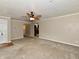 Open-concept living room featuring a ceiling fan and neutral wall paint at 812 Madison St, Frankton, IN 46044