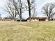 Large yard showing the side and back of the home at 812 Madison St, Frankton, IN 46044