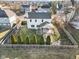 A high aerial view of the back of the home, showing the yard and covered patio area at 8352 Alcona Dr, Indianapolis, IN 46237