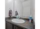Bathroom with a vanity and a large mirror that increases the feeling of space at 8352 Alcona Dr, Indianapolis, IN 46237