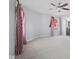 Bright bedroom featuring neutral walls, carpet, ceiling fan and an attached bathroom at 8352 Alcona Dr, Indianapolis, IN 46237