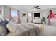 Virtual staging of bedroom featuring queen bed, tv, dresser, artwork, and natural lighting at 8352 Alcona Dr, Indianapolis, IN 46237