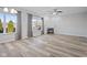 Bright living room featuring a fireplace, large windows, and light-colored floors at 8352 Alcona Dr, Indianapolis, IN 46237
