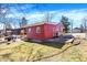 Property with a red home, grassy yard, and a concrete patio, offering outdoor enjoyment at 8657 S Nash Dr, Nineveh, IN 46164
