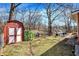 Backyard with utility shed, waterside view, and outdoor seating, ideal for relaxation at 8657 S Nash Dr, Nineveh, IN 46164