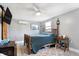 Bedroom with a light ceiling fan, a vintage-style bed, and a rustic decorative motif at 8657 S Nash Dr, Nineveh, IN 46164