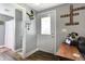Inviting entryway with decorative wall art and a white door, creating a charming and personalized welcome at 8657 S Nash Dr, Nineveh, IN 46164