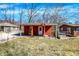 Charming red home with a covered porch, bench and swing, complete with a cozy and inviting curb appeal at 8657 S Nash Dr, Nineveh, IN 46164