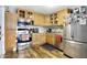 Charming kitchen featuring warm wood cabinets and stainless steel appliances at 8657 S Nash Dr, Nineveh, IN 46164