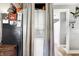A stacked washer and dryer unit discreetly tucked away behind curtains at 8657 S Nash Dr, Nineveh, IN 46164