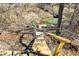 View of the property's wooden stairs descending to the community lake through a gate at 8657 S Nash Dr, Nineveh, IN 46164