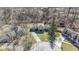 Aerial view of the property showcasing its location and surroundings with mature trees and a circular driveway at 8831 Lincolncreek Cir, Indianapolis, IN 46234