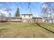 The backyard features a spacious lawn and a charming deck, perfect for outdoor enjoyment at 8831 Lincolncreek Cir, Indianapolis, IN 46234