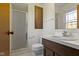 This bathroom features a walk-in shower, vanity with sink, toilet, and medicine cabinet at 8831 Lincolncreek Cir, Indianapolis, IN 46234