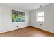 Bright bedroom with neutral walls, hardwood floors, and a large window at 8831 Lincolncreek Cir, Indianapolis, IN 46234