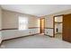Spacious bedroom with soft carpet, large window, and convenient closet access at 8831 Lincolncreek Cir, Indianapolis, IN 46234