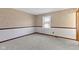 Comfortable bedroom with soft carpet, wainscoting, and a bright window at 8831 Lincolncreek Cir, Indianapolis, IN 46234