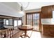 Sunny breakfast nook with a round table, sliding glass doors, and views of the backyard at 8831 Lincolncreek Cir, Indianapolis, IN 46234