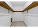 Walk-in closet with ample shelving and carpeting at 8831 Lincolncreek Cir, Indianapolis, IN 46234