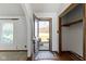 Bright entryway with hardwood floors, a coat closet, and a view to the front yard at 8831 Lincolncreek Cir, Indianapolis, IN 46234