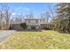 Charming two-story home featuring a two-car garage, a well-manicured lawn, and mature trees at 8831 Lincolncreek Cir, Indianapolis, IN 46234