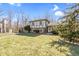 Two-story home with a lush green lawn and mature trees creating a serene and inviting landscape at 8831 Lincolncreek Cir, Indianapolis, IN 46234