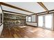 Inviting living room with hardwood floors, exposed beams, and a brick fireplace at 8831 Lincolncreek Cir, Indianapolis, IN 46234