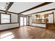 Open-concept living room with hardwood floors, built-in shelves, and natural light at 8831 Lincolncreek Cir, Indianapolis, IN 46234