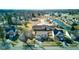 Aerial view of a quiet residential neighborhood with ponds, mature trees, and well-maintained lawns at 917 Claiborne Ln, Lebanon, IN 46052