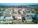 Overhead view of a quiet neighborhood with tree-lined streets, a serene pond, and well-maintained homes at 917 Claiborne Ln, Lebanon, IN 46052