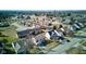 An aerial view showcases a neighborhood with a pond, mature trees, and beautifully maintained homes at 917 Claiborne Ln, Lebanon, IN 46052