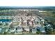 Sprawling aerial view of a peaceful residential neighborhood with pond, surrounded by lush trees at 917 Claiborne Ln, Lebanon, IN 46052