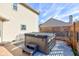 Backyard with a hot tub and privacy screen on a patio at 917 Claiborne Ln, Lebanon, IN 46052