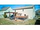 Backyard with a wooden deck, pergola, and green lawn, perfect for outdoor living and entertaining at 917 Claiborne Ln, Lebanon, IN 46052