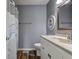 Bathroom showcasing a toilet, vanity with a sink and mirror, and wood look flooring at 917 Claiborne Ln, Lebanon, IN 46052