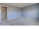 A neutral bedroom with light grey walls and a standard closet at 917 Claiborne Ln, Lebanon, IN 46052