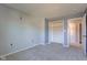 A neutral bedroom with light grey walls and a standard closet at 917 Claiborne Ln, Lebanon, IN 46052