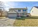 Traditional two-story home featuring a bay window and attached two-car garage at 917 Claiborne Ln, Lebanon, IN 46052