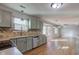 Open concept kitchen with stainless steel appliances, hardwood floors, and natural light at 917 Claiborne Ln, Lebanon, IN 46052