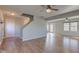 Open-concept living room features hardwood floors, ceiling fans, and lots of natural light at 917 Claiborne Ln, Lebanon, IN 46052