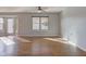 Bright living area with large windows, neutral paint, and hardwood flooring at 917 Claiborne Ln, Lebanon, IN 46052